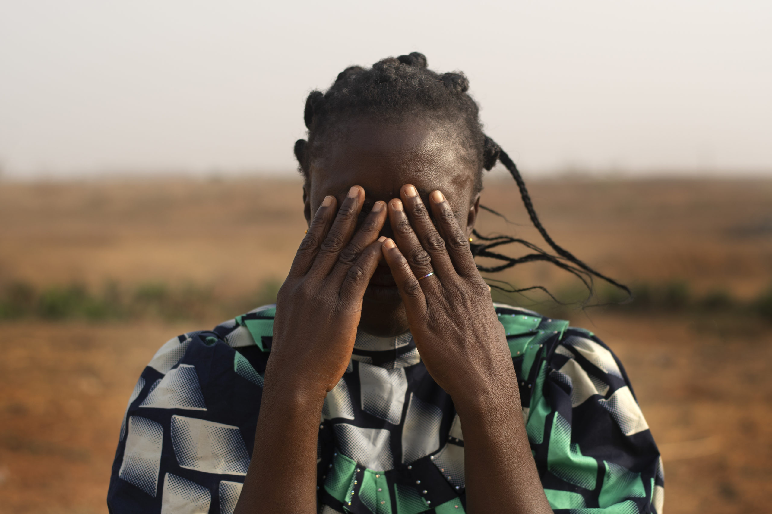 woman closing her face